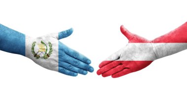 Avusturya ve Guatemala bayrakları arasındaki el sıkışma ellerinde resmedilmiş şeffaf görüntü.