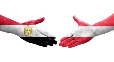 Ellerinde Avusturya ve Mısır bayrakları arasında el sıkışma, izole şeffaf görüntü.