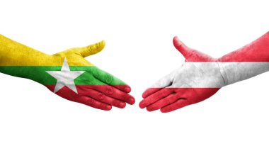 Ellerinde Avusturya ve Myanmar bayrakları arasında el sıkışma, izole şeffaf görüntü.