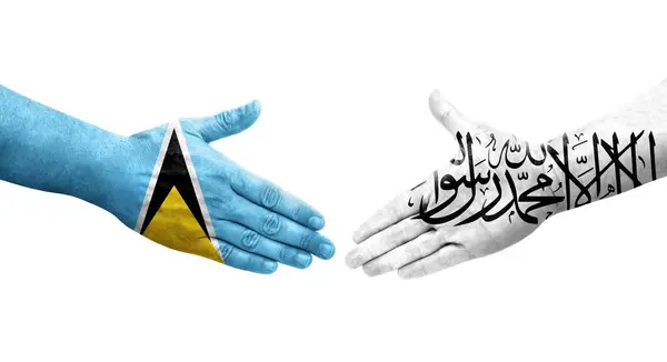 アフガニスタンとセントルシアの旗の間の握手手に描かれた孤立した透明なイメージ — ストック写真