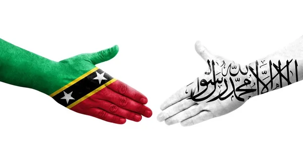 Handdruk Tussen Afghanistan Saint Kitts Nevis Vlaggen Geschilderd Handen Geïsoleerd — Stockfoto