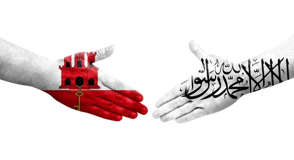 Handdruk Tussen Afghaanse Gibraltar Vlaggen Handen Geschilderd Geïsoleerd Transparant Beeld — Stockfoto
