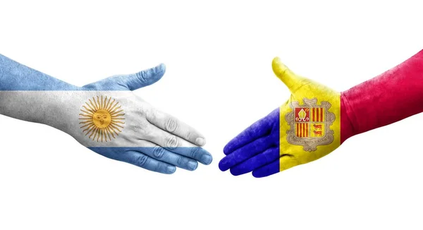 手に描かれたアンドラとアルゼンチンの旗の間の握手 孤立した透明なイメージ — ストック写真