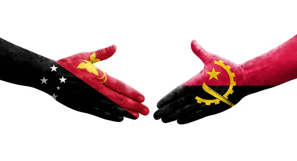 Uścisk Dłoni Między Angolą Papuą Nową Gwineą Malowane Rękach Flagi — Zdjęcie stockowe