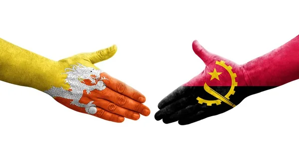 Apretón Manos Entre Angola Bután Banderas Pintadas Las Manos Imagen —  Fotos de Stock