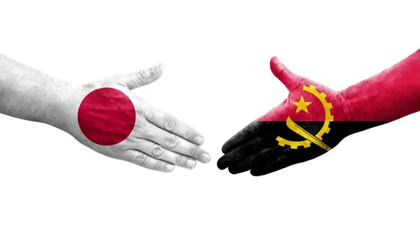 Händedruck Zwischen Angolanischen Und Japanischen Flaggen Auf Hände Gemalt Isoliertes — Stockfoto