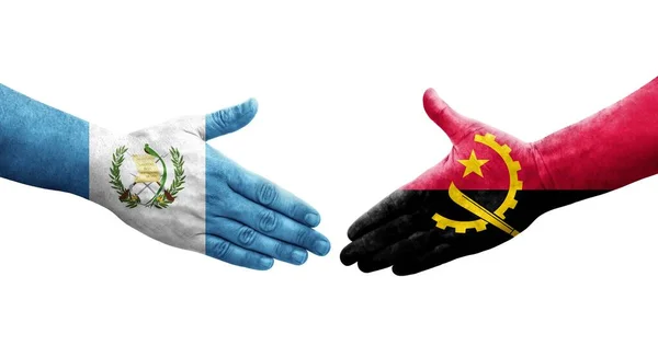 Handdruk Tussen Angola Guatemala Vlaggen Geschilderd Handen Geïsoleerd Transparant Beeld — Stockfoto