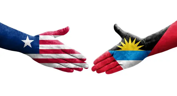 Händedruck Zwischen Antigua Und Barbuda Und Liberia Flaggen Aufgemalt Isoliertes — Stockfoto