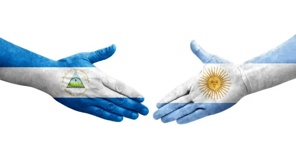 Saludo Entre Banderas Argentinas Nicaragüenses Pintadas Las Manos Imagen Transparente — Foto de Stock