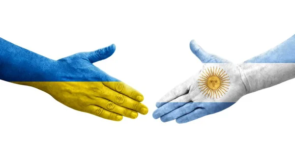 Рукопожатие Между Аргентиной Украиной Раскрашенные Руках Флаги Изолированное Прозрачное Изображение — стоковое фото
