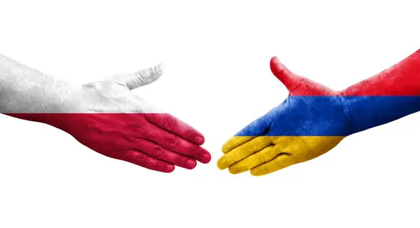 stock image Handshake between Armenia and Poland flags painted on hands, isolated transparent image.