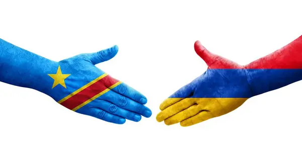 Stock image Handshake between Armenia and Dr Congo flags painted on hands, isolated transparent image.