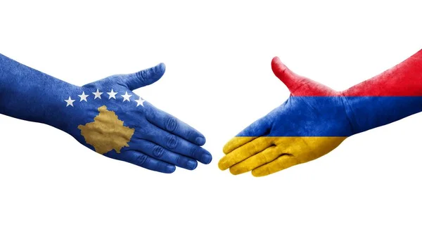 stock image Handshake between Armenia and Kosovo flags painted on hands, isolated transparent image.