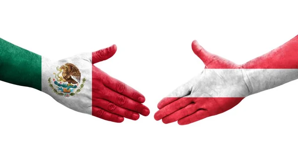 手に描かれたオーストリアとメキシコの旗の間の握手 孤立した透明なイメージ — ストック写真