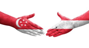 Ellerinde Avusturya ve Singapur bayrakları arasında el sıkışma, izole şeffaf görüntü.