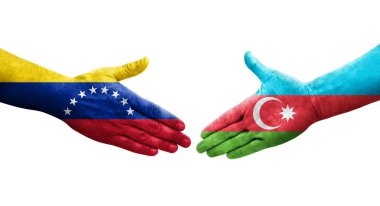 Ellerinde Azerbaycan ve Venezuela bayrakları arasında el sıkışma, izole şeffaf görüntü.