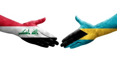 Bahamalar ve Irak bayrakları arasında el sıkışma, izole şeffaf görüntü.