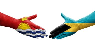 Bahamalar ve Kiribati bayrakları arasında el sıkışma, izole şeffaf görüntü.