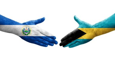 Bahamalar ve El Salvador bayrakları arasında el sıkışma, izole şeffaf görüntü.