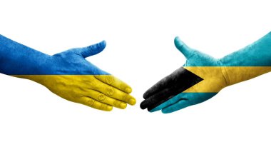 Bahamalar ve Ukrayna bayrakları arasında el sıkışma, izole şeffaf görüntü.