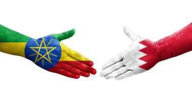 Bahreyn ve Etiyopya bayrakları arasındaki el sıkışma ellere boyanmış, izole şeffaf görüntü.