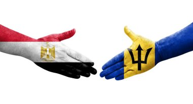 Barbados ve Mısır bayrakları arasındaki el sıkışma ellerinde resmedilmiş şeffaf görüntü.