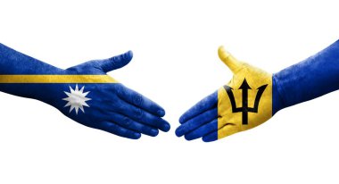 Ellerinde Barbados ve Nauru bayrakları arasında el sıkışma, izole şeffaf görüntü.