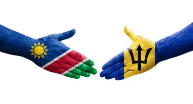 Ellerinde Barbados ve Namibya bayrakları arasında el sıkışma, izole şeffaf görüntü.