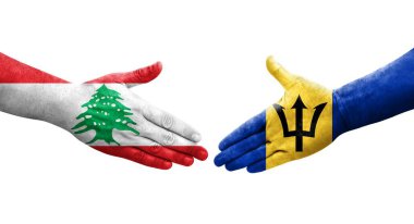 Ellerinde Barbados ve Lübnan bayrakları arasında el sıkışma, izole şeffaf görüntü.