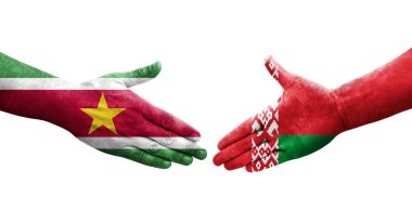 Belarus ve Surinam bayrakları arasında el sıkışma, izole şeffaf görüntü.