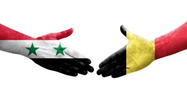 Belçika ve Suriye bayrakları arasında el sıkışma, izole şeffaf görüntü.