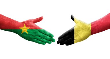 Belçika ve Burkina Faso bayrakları arasında el sıkışma, izole şeffaf görüntü.