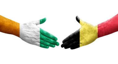 Belçika ve Fildişi Sahili bayrakları arasında el sıkışma, izole şeffaf görüntü.