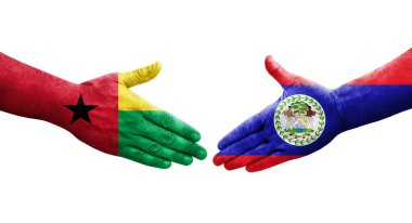 Belize ve Gine Bissau bayrakları arasındaki el sıkışma ellerinde izole şeffaf görüntü.