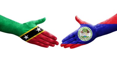 Belize, Saint Kitts ve Nevis bayrakları arasındaki el sıkışma, izole şeffaf görüntü..