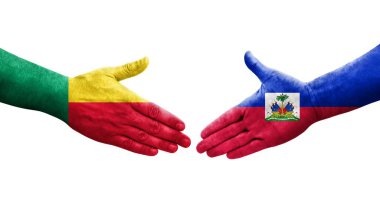 Benin ve Haiti bayrakları arasındaki el sıkışma, izole şeffaf görüntü.