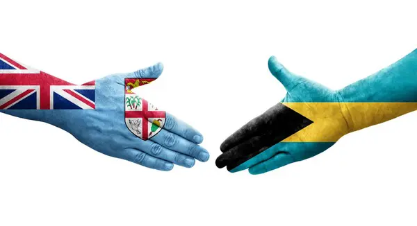 Handdruk Tussen Bahamas Fiji Vlaggen Geschilderd Handen Geïsoleerd Transparant Beeld — Stockfoto
