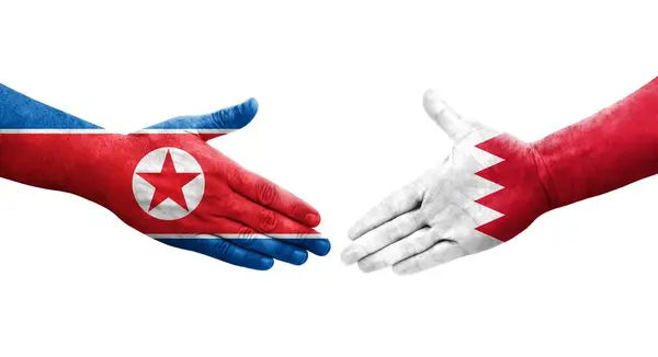 Mano Apretada Entre Bahréin Corea Del Norte Banderas Pintadas Las —  Fotos de Stock