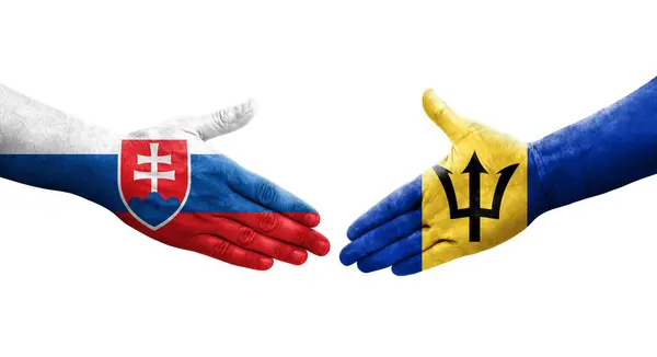 Stock image Handshake between Barbados and Slovakia flags painted on hands, isolated transparent image.