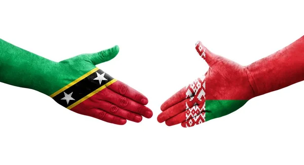 Uścisk Dłoni Między Białorusią Saint Kitts Flagami Nevis Namalowanymi Rękach — Zdjęcie stockowe