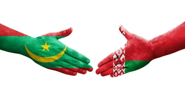 stock image Handshake between Belarus and Mauritania flags painted on hands, isolated transparent image.