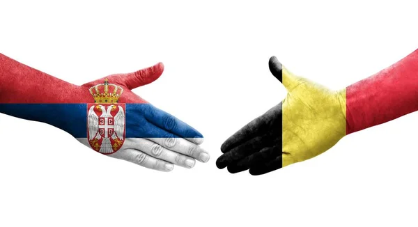 Händedruck Zwischen Belgischen Und Serbischen Flaggen Auf Hände Gemalt Isoliertes — Stockfoto