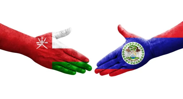 Stretta Mano Tra Bandiere Belize Oman Dipinte Mani Immagine Isolata — Foto Stock