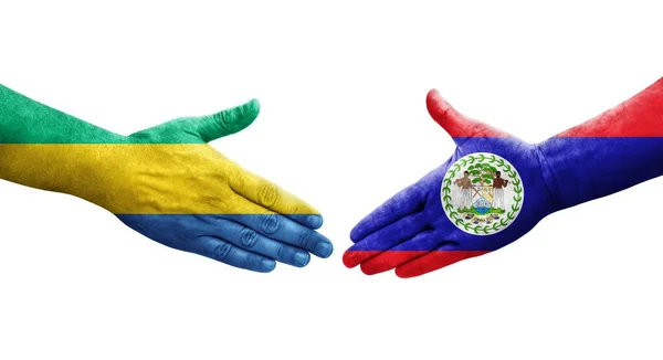 ベリーズとガボンの旗の間の握手手に描かれた孤立した透明なイメージ — ストック写真