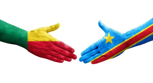 stock image Handshake between Benin and Dr Congo flags painted on hands, isolated transparent image.