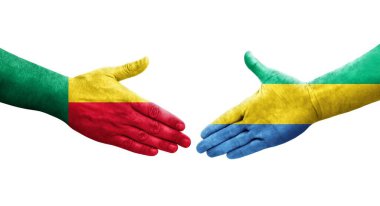 Benin ve Gabon bayrakları arasındaki el sıkışma ellerinde resmedilmiş şeffaf görüntü.
