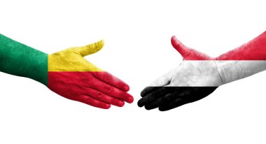 Benin ve Yemen bayrakları arasındaki el sıkışma ellerinde resmedilmiş şeffaf görüntü.