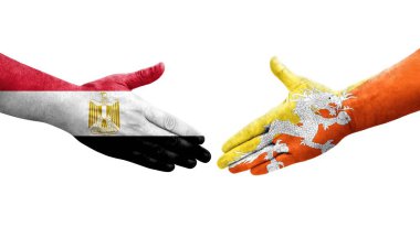 Bhutan ve Mısır bayrakları arasındaki el sıkışma ellerinde resmedilmiş şeffaf görüntü.