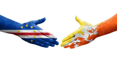 Bhutan ve Cape Verde bayrakları arasındaki tokalaşma elleri boyalı, izole şeffaf görüntü.