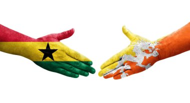 Bhutan ve Gana bayrakları arasındaki tokalaşma elleri boyalı, izole şeffaf görüntü.
